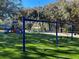 A colorful community playground with slides, swings, and a soft, safe ground cover at 4251 Preserve Pl, Palm Harbor, FL 34685