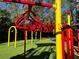 Vibrant playground equipment set in green artificial turf for community recreation at 4251 Preserve Pl, Palm Harbor, FL 34685