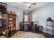 Home office with built-in shelving, desk, and plenty of light at 4940 Willow Ridge Ter, Valrico, FL 33596