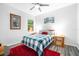Cozy bedroom featuring a blue and white checkered bedspread at 4940 Willow Ridge Ter, Valrico, FL 33596