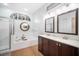 Elegant bathroom with double vanity, soaking tub, and walk-in shower at 4940 Willow Ridge Ter, Valrico, FL 33596