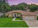 Charming single-story home with a two-car garage and manicured lawn at 4940 Willow Ridge Ter, Valrico, FL 33596