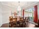 Bright dining room with hardwood floors and a chandelier at 4940 Willow Ridge Ter, Valrico, FL 33596