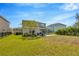 Large backyard with grassy area and patio at 16462 Courtyard Loop, Land O Lakes, FL 34638