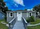 Gray house with white door and walkway at 1650 Prescott S St, St Petersburg, FL 33712