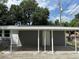 Covered carport with attached storage room at 1650 Prescott S St, St Petersburg, FL 33712