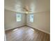 Bright bedroom with two windows and ceiling fan at 1650 Prescott S St, St Petersburg, FL 33712