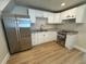 Modern kitchen featuring white cabinets and stainless steel appliances at 1650 Prescott S St, St Petersburg, FL 33712