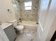 Updated bathroom with new bathtub, toilet, and vanity at 1650 Prescott S St, St Petersburg, FL 33712