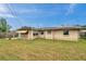 Large backyard with home and solar panels visible at 5110 Cape Cod Dr, Holiday, FL 34690