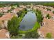 Community view with lake and condo buildings at 10409 Villa View Cir, Tampa, FL 33647