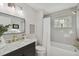 Modern bathroom with marble vanity, bathtub, and gold fixtures at 209 W Emma St, Tampa, FL 33603