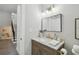 Clean bathroom with marble countertop vanity and updated fixtures at 209 W Emma St, Tampa, FL 33603