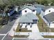 An aerial shot of a newly built home featuring a modern design and a well maintained lawn at 2404 1/2 E Chelsea, Tampa, FL 33610