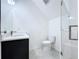 A modern bathroom featuring a vanity with quartz countertops and a glass-enclosed shower at 2404 1/2 E Chelsea, Tampa, FL 33610