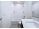 Bright bathroom with a modern vanity, combination tub and shower, and tiled floor at 2404 1/2 E Chelsea, Tampa, FL 33610
