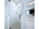 A shower area featuring glass doors and gray penny tile flooring at 2404 1/2 E Chelsea, Tampa, FL 33610