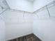 Empty walk-in closet featuring wire shelving, ready for organized storage solutions at 2404 1/2 E Chelsea, Tampa, FL 33610