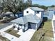 New home showcasing modern architectural design and manicured landscaping, perfect curb appeal at 2404 1/2 E Chelsea, Tampa, FL 33610