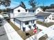 Charming home featuring a gray roof and white paint at 2404 1/2 E Chelsea, Tampa, FL 33610