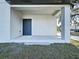 View of the front porch featuring a covered entrance and concrete flooring at 2404 1/2 E Chelsea, Tampa, FL 33610