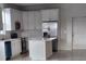 Bright kitchen with white cabinets, stainless steel appliances, and a center island at 2404 1/2 E Chelsea, Tampa, FL 33610