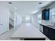 Kitchen features an island, a double door entrance, and a view to the second floor at 2404 1/2 E Chelsea, Tampa, FL 33610