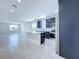 Kitchen with stainless steel appliances, black cabinets, island, and tile floors at 2404 1/2 E Chelsea, Tampa, FL 33610