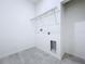 Spacious laundry room featuring tile floors and a wire shelf at 2404 1/2 E Chelsea, Tampa, FL 33610