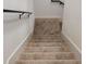 Carpeted stairs featuring white walls and a black handrail at 2404 1/2 E Chelsea, Tampa, FL 33610