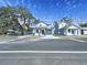 Inviting home with a well-manicured lawn, attached garage, and classic street appeal at 2404 1/2 E Chelsea, Tampa, FL 33610