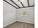 Well-lit bedroom, featuring wood-look floors and a window at 815 St Francis St, Brooksville, FL 34601