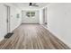 Bright and airy living room with new flooring and ceiling fan at 815 St Francis St, Brooksville, FL 34601