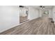 Open concept living area with wood-look floors and kitchen view at 815 St Francis St, Brooksville, FL 34601