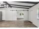 Spacious living area with stylish barn doors and wood flooring at 815 St Francis St, Brooksville, FL 34601