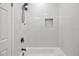 Modern bathroom with a white subway tile shower and tub at 815 St Francis St, Brooksville, FL 34601