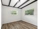 Spacious bedroom featuring wood-look floors and a neutral color palette at 815 St Francis St, Brooksville, FL 34601