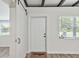 Inviting entryway with barn doors and wood-look floors at 815 St Francis St, Brooksville, FL 34601