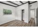 Charming bedroom with wood-look floors and sliding door closet at 815 St Francis St, Brooksville, FL 34601