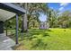 Large backyard with a detached shed and mature trees at 815 St Francis St, Brooksville, FL 34601