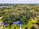 House nestled in a wooded area with a large lot at 815 St Francis St, Brooksville, FL 34601