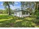 Side view of the house, showcasing a simple design and landscaping at 815 St Francis St, Brooksville, FL 34601