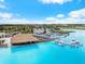 Crystal-clear lagoon pool with swim-up bar and lounge area at 8861 Forge Breeze Loop, Wesley Chapel, FL 33545