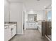 Modern bathroom with double vanity, soaking tub, and walk-in shower at 8861 Forge Breeze Loop, Wesley Chapel, FL 33545