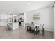 Bright dining area with seating for six and kitchen views at 8861 Forge Breeze Loop, Wesley Chapel, FL 33545