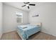 Cozy bedroom with a double bed and window at 8861 Forge Breeze Loop, Wesley Chapel, FL 33545