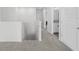 Upstairs hallway with access to bedrooms and bath at 8861 Forge Breeze Loop, Wesley Chapel, FL 33545