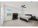Bright bedroom with double bed and large window at 8861 Forge Breeze Loop, Wesley Chapel, FL 33545
