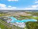 Expansive aerial view of the community and crystal lagoon at 8861 Forge Breeze Loop, Wesley Chapel, FL 33545