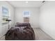 Bright bedroom with two beanbag chairs and window blinds at 8861 Forge Breeze Loop, Wesley Chapel, FL 33545
